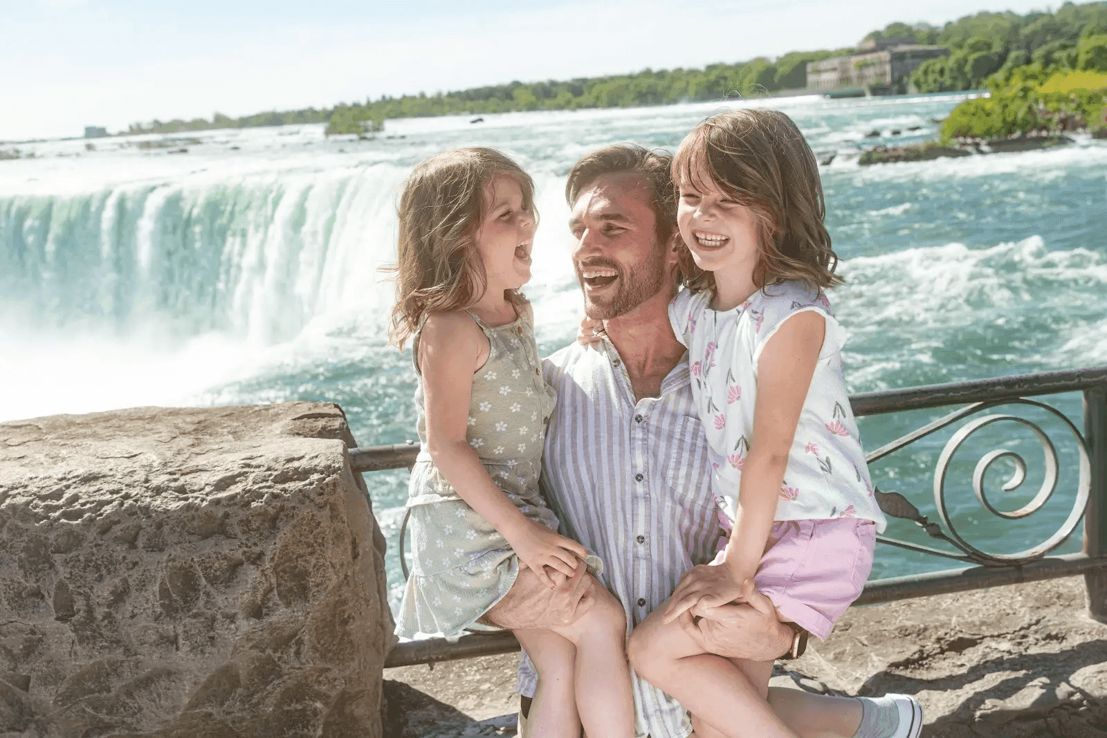 Family laughing together on a ferris wheel ride.